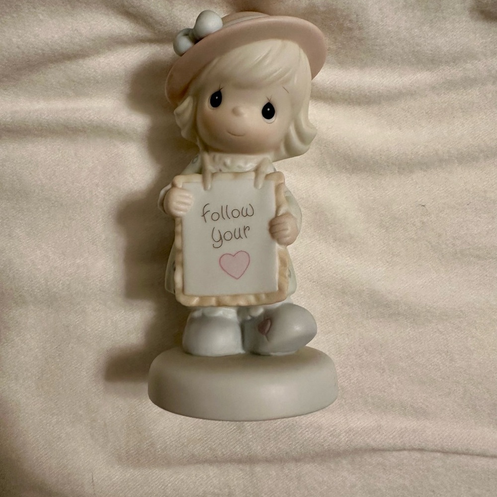 Charming Figurine with Pink Hat